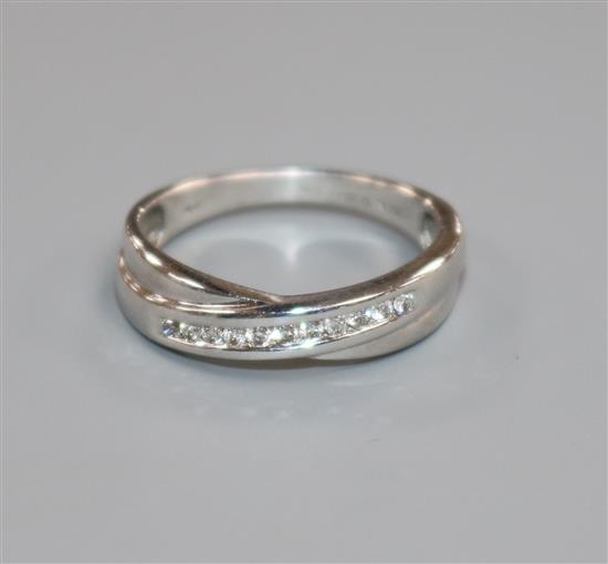 A modern 18ct white gold and eleven stone diamond ring, size K.
